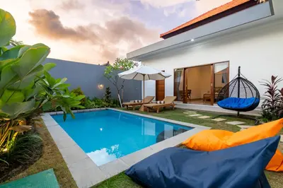a swimming pool in the backyard of a villa at Ageta Villa 3 bedrooms Umalas with pool in Kerobokan