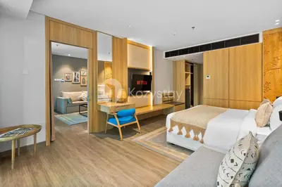 a hotel room with a bed and a desk at Moriya by Kozystay - Nusa Dua in Nusa Dua