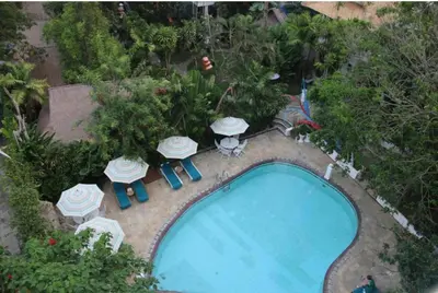 an overhead view of a swimming pool with tables and chairs at 2bedroom Apartment Petitenget Beach in Seminyak