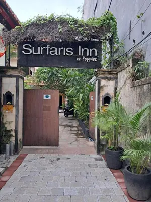 a sign that reads quarters inn on papers on a building at SURFARIS INN on poppies 2 apartment in Legian