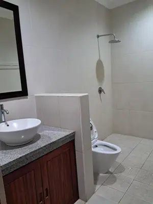 a bathroom with a sink and a toilet at SURFARIS INN on poppies 2 apartment in Legian