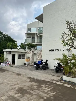 two motorcycles parked in front of a building at HŌM Coliving Bali in Kerobokan