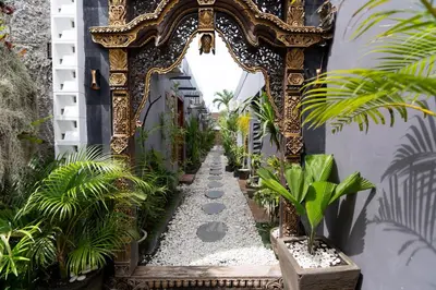 an archway in a building with plants in it at Griya Sadhana Dewi Sri in Legian
