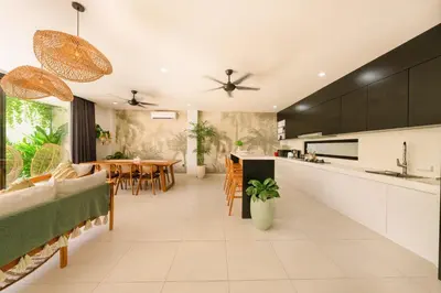 an open kitchen and living room with a dining room at Shanti Villa - 3BR Luxury Private Pool Villa in Seminyak in Seminyak
