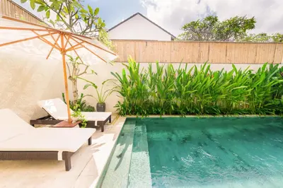 a swimming pool in the backyard of a villa at Shanti Villa - 3BR Luxury Private Pool Villa in Seminyak in Seminyak