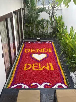 a red carpet with the words denida delhi on it at Anari Villas Kuta by The Wina Resorts in Legian