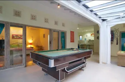 a living room with a pool table in it at Villa bunny seminyak in Seminyak