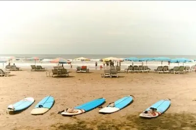a group of people laying on surfboards on a beach at Villa bunny seminyak in Seminyak