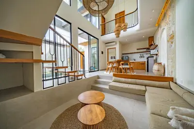 a living room with a couch and a table at Casa Samudra - 3BR Villa in Seminyak in Seminyak