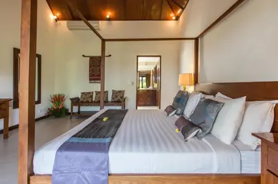 a bedroom with a large bed in a room at Villa Sedap Malam - Private 2 Bedroom Villa Near Seminyak Beach in Kuta