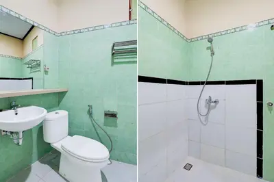 a bathroom with a toilet and a shower and a sink at Townhouse Oak Legian Near Legian Beach Formerly Sayang Maha Merta in Legian