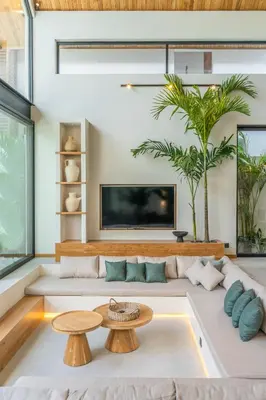 a living room with a couch and a tv at Villa Bayu by GORO in Canggu