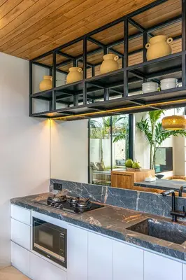 a kitchen with a stove and a counter top at Villa Bayu by GORO in Canggu