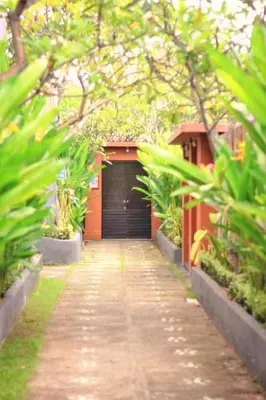 a driveway leading to a garage with a door at Private Pool Villas Kuta Bali in Kuta
