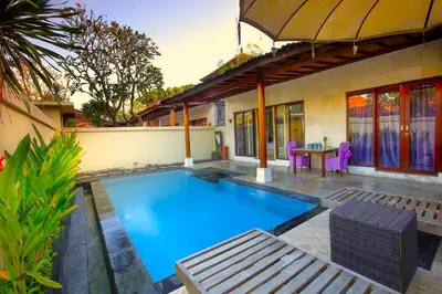 a swimming pool in the backyard of a house at Private Pool Villas Kuta Bali in Kuta