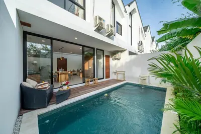 a swimming pool in the backyard of a house at Umaliving Villa Seminyak Bali in Seminyak