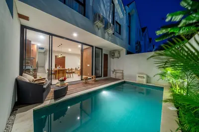 a swimming pool in the backyard of a house at Umaliving Villa Seminyak Bali in Seminyak
