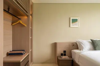 a hotel room with a bed and a table at Villa Mesra Stunning Paddy Fields Views - Canggu Berawa in Canggu