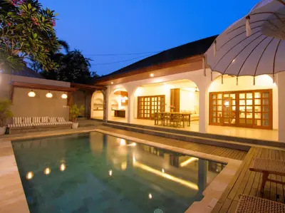 a swimming pool in the backyard of a house at Near Beach Villa in Seminyak