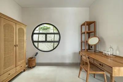 a dressing room with a mirror and a wooden desk at Villa Tibrava Umalas by BaliSuperHost in Canggu