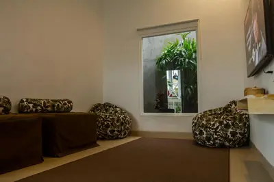 a living room with two couches and a window at Villa Orked 4 with 12 meter pool in Seminyak