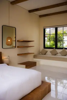 a bedroom with a bed and a window at Villa Batu Putih 2 Seminyak - No FLOOD in Seminyak