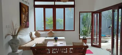 a living room with a couch and a table at Seminyak great Location Villa in Seminyak
