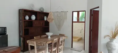 a dining room with a table and a vase on it at Seminyak great Location Villa in Seminyak