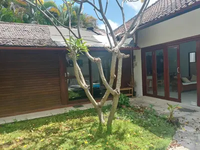 a small tree in front of a house at Seminyak great Location Villa in Seminyak