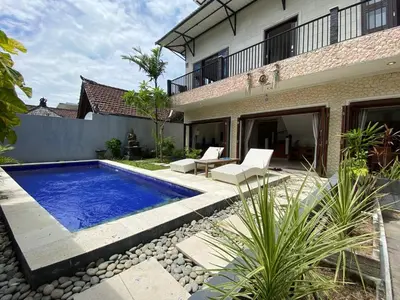 a swimming pool in the backyard of a house at Amazing Villa in Seminyak Petitenget Top Location in Seminyak