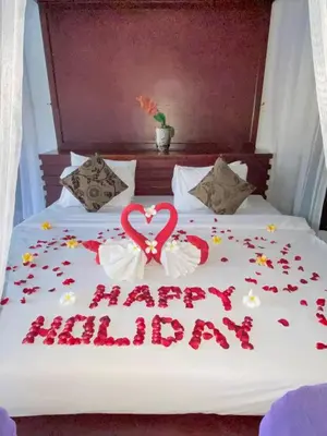 a bed with a happy birthday sign on it at One BedRoom Villa with Private Pool near DPS Airport in Kuta