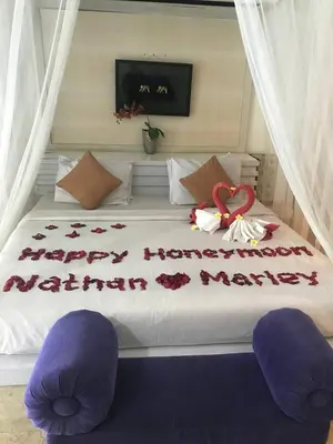 a bedroom with a bed with a happy anniversary written on it at One BedRoom Villa with Private Pool near DPS Airport in Kuta