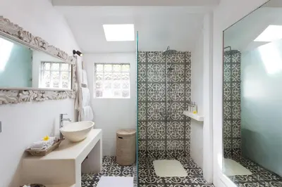 a bathroom with a sink and a mirror at Bear Cottage 4 Bedroom Luxury Villa - Petitenget, Seminyak in Seminyak