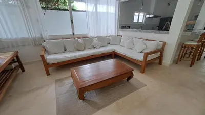 a living room with a couch and a coffee table at Bear Cottage 4 Bedroom Luxury Villa - Petitenget, Seminyak in Seminyak