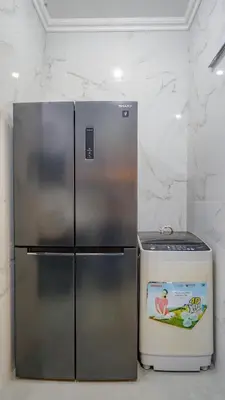 a refrigerator and a cooler in a room at Rumah Jimbaran Kuta 3 bedroom 9 pax SukaBali 1 in Jimbaran