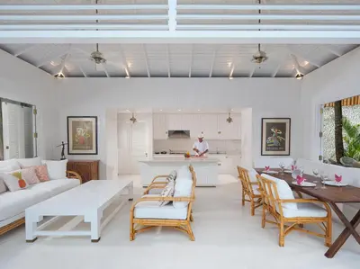 a living room with a couch and a table at Villa Lulito in Seminyak