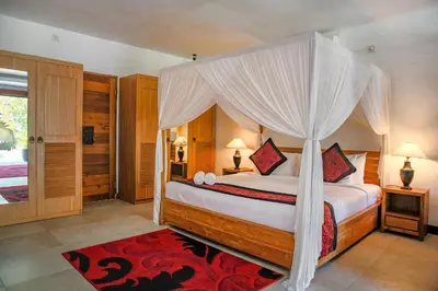 a bedroom with a bed with a canopy at Villa Bali Caviar in Seminyak
