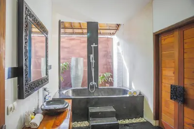 a bathroom with a sink and a tub at Villa Bali Caviar in Seminyak