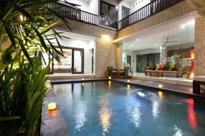 a swimming pool in the middle of a house at Villa Rendezvous Bali in Seminyak
