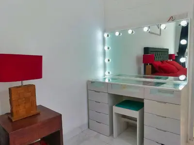 a dressing room with a desk and a mirror at Villa Blue - 4BR authentic and atypical villa in Seminyak in Seminyak