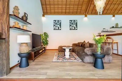 a living room with a couch and a table at Villa Marsin Umalas - 10 Minutes to Finns Beach Club in Seminyak