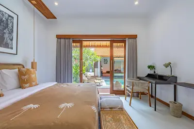 a bedroom with a bed and a desk at Villa Marsin Umalas - 10 Minutes to Finns Beach Club in Seminyak