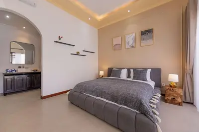 a bedroom with a large bed in a room at Villa Phoenix Brand New 1BR in Umalas, Bali in Seminyak