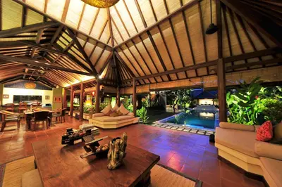 a large living room with a large wooden ceiling at Villa Mata Budha Seminyak in Seminyak