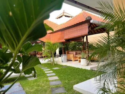 a house with a roof with a grass yard at 4bedroom - Kamaya Villa in center of Seminyak in Seminyak