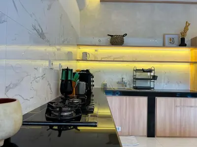 a kitchen with a counter top with a stove at 4bedroom - Kamaya Villa in center of Seminyak in Seminyak