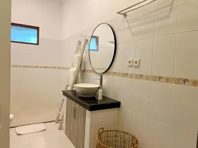 a bathroom with a sink and a mirror at 4bedroom - Kamaya Villa in center of Seminyak in Seminyak