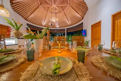 a wooden table with a plate of food on it at Villa Lea Luxury Oasis in Seminyak Umalas with private pool 4BR in Seminyak