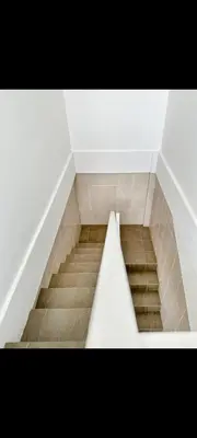 a staircase in a room with a stair case at narayuka house kamar 3 in Seminyak