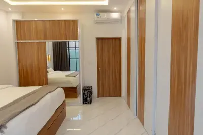a hotel room with a bed and a mirror at Cozy Seminyak Loft 360 in Seminyak